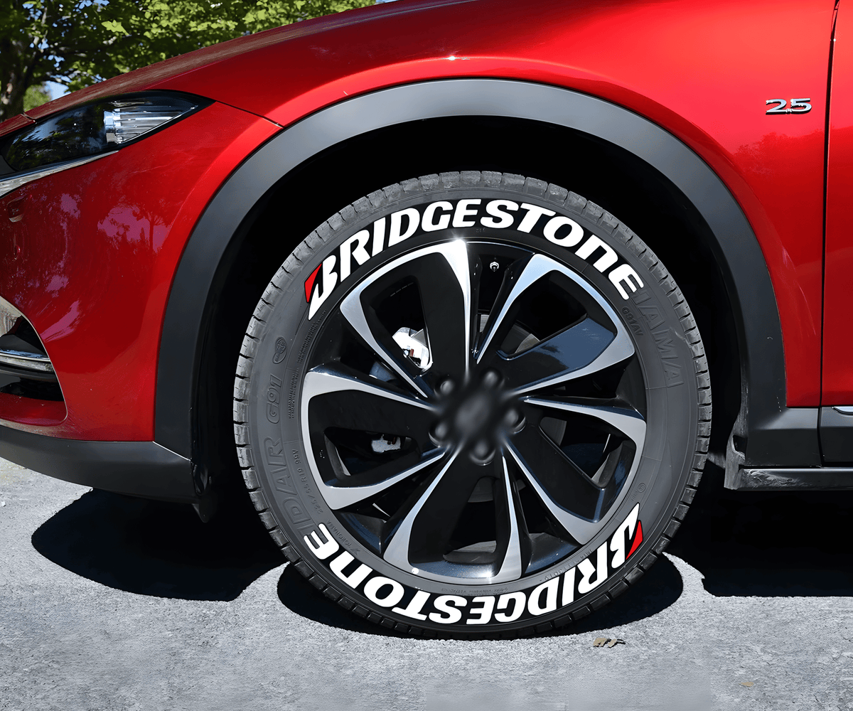 Red SUV featuring BRIDGESTONE 3D tire lettering stickers in white with red accents, applied on the sidewall for a sporty and performance-driven appearance.