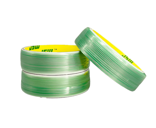 Ultra-realistic transparent background image featuring three green rolls of ChroMorpher DesignLine Knifeless Tape, two stacked horizontally and one leaning diagonally. Designed for precise, blade-free vinyl cutting on car wraps and chrome deletes.