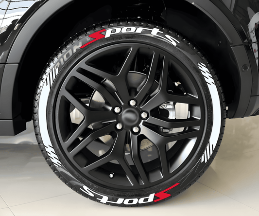 Close-up of a black SUV with ChroMorpher SportsX Tire Lettering applied to the tires. The decals feature bold white "Sports" text with red and white racing stripes, enhancing the vehicle's sporty and high-performance look.