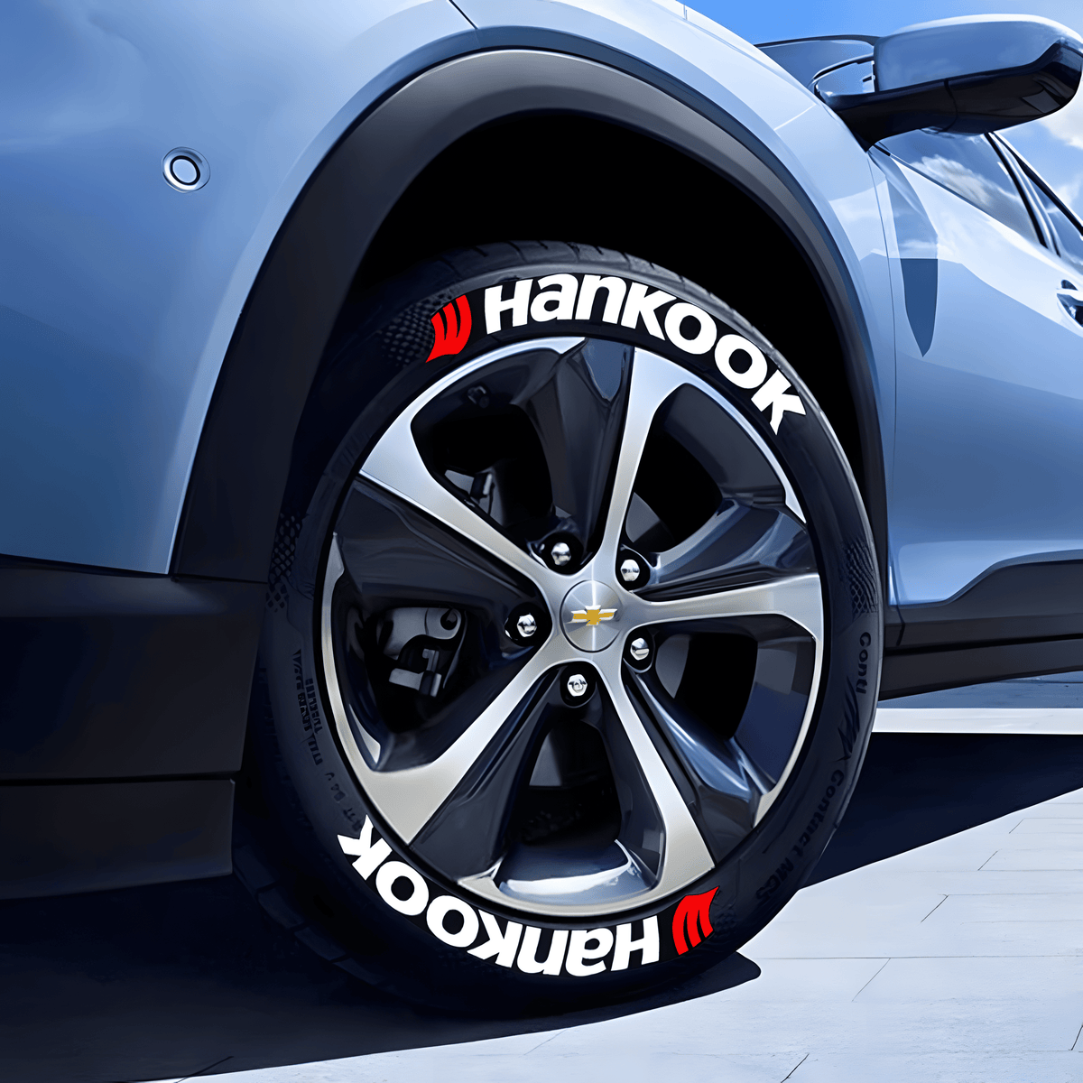 Close-up of a Chevrolet wheel fitted with ChroMorpher Hankook 3D Tire Lettering. The bold white Hankook branding with a red logo enhances the tire’s sporty aesthetic, making it stand out for a performance-driven look. Ideal for car enthusiasts who want a racing-inspired touch.