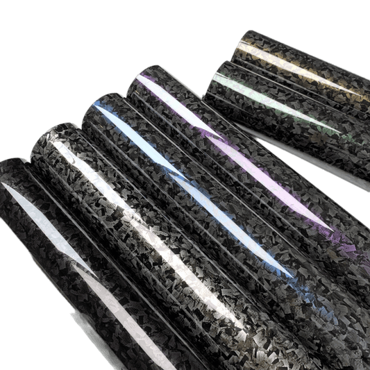 An angled view of Glossy Forged Carbon Fiber Vinyl Wrap rolls in multiple vibrant colors, including black, silver, blue, purple, green, and gold. Each roll features a sleek, high-gloss forged carbon finish, showcasing the premium quality and professional-grade look ideal for car and accessory customization.