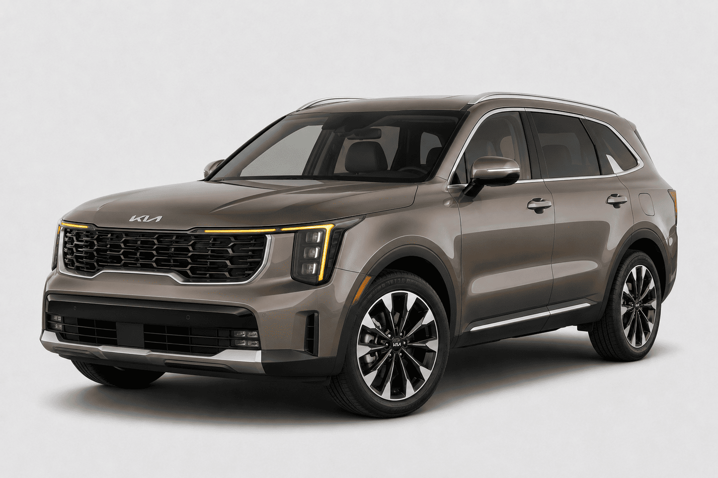 Kia Sorento SUV in metallic gray with chrome window trim, roof rails, and side accents, shown from a front three-quarter angle on a light background.