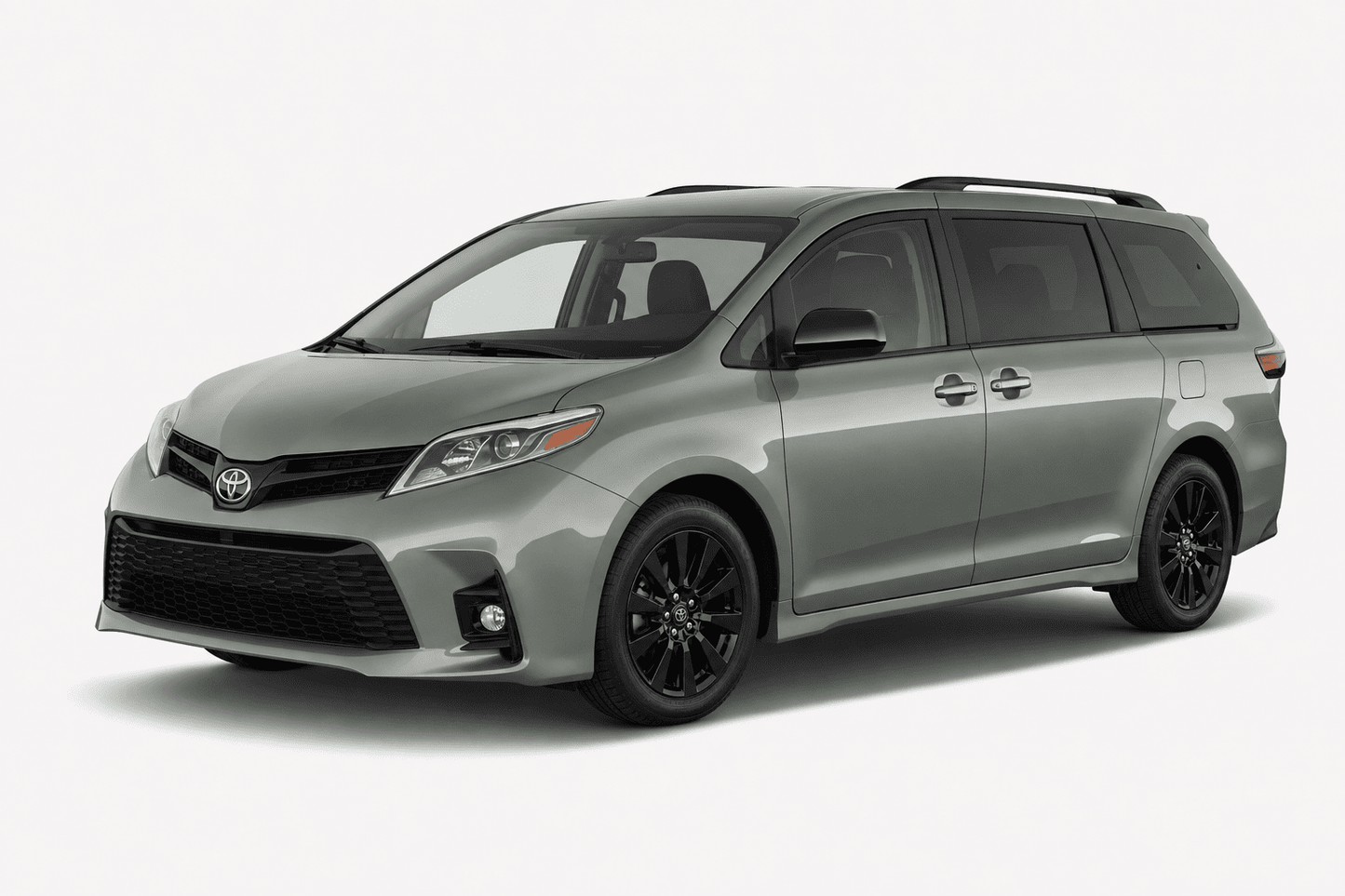 A silver-gray Toyota Sienna minivan with black wheels and roof rails, shown from a three-quarter front angle on a light gray studio background.