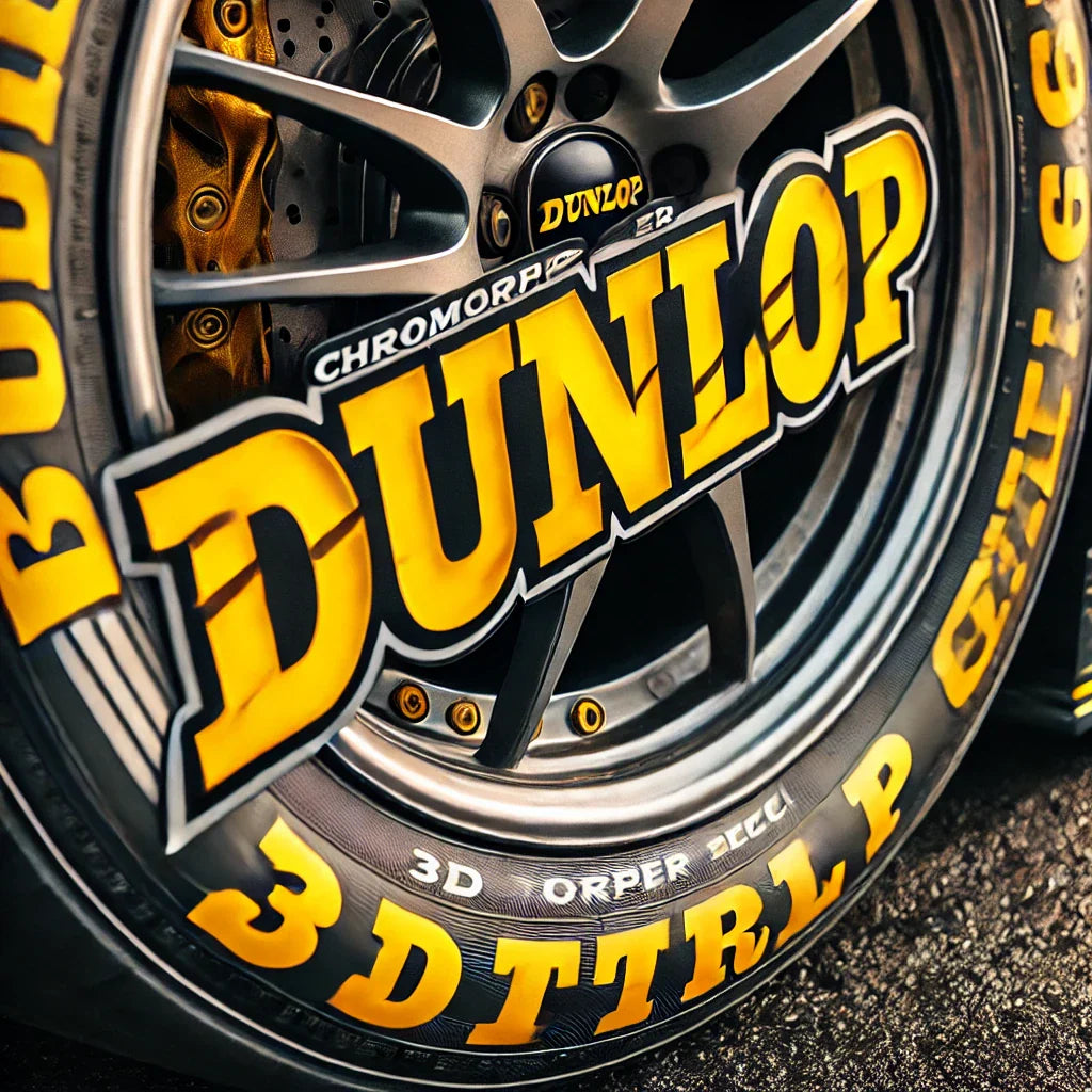A close-up of a car tire featuring ChroMorpher Dunlop 3D Tire Lettering Decals. The bold, yellow raised letters spell out 'Dunlop,' providing a high-contrast, motorsport-inspired look.