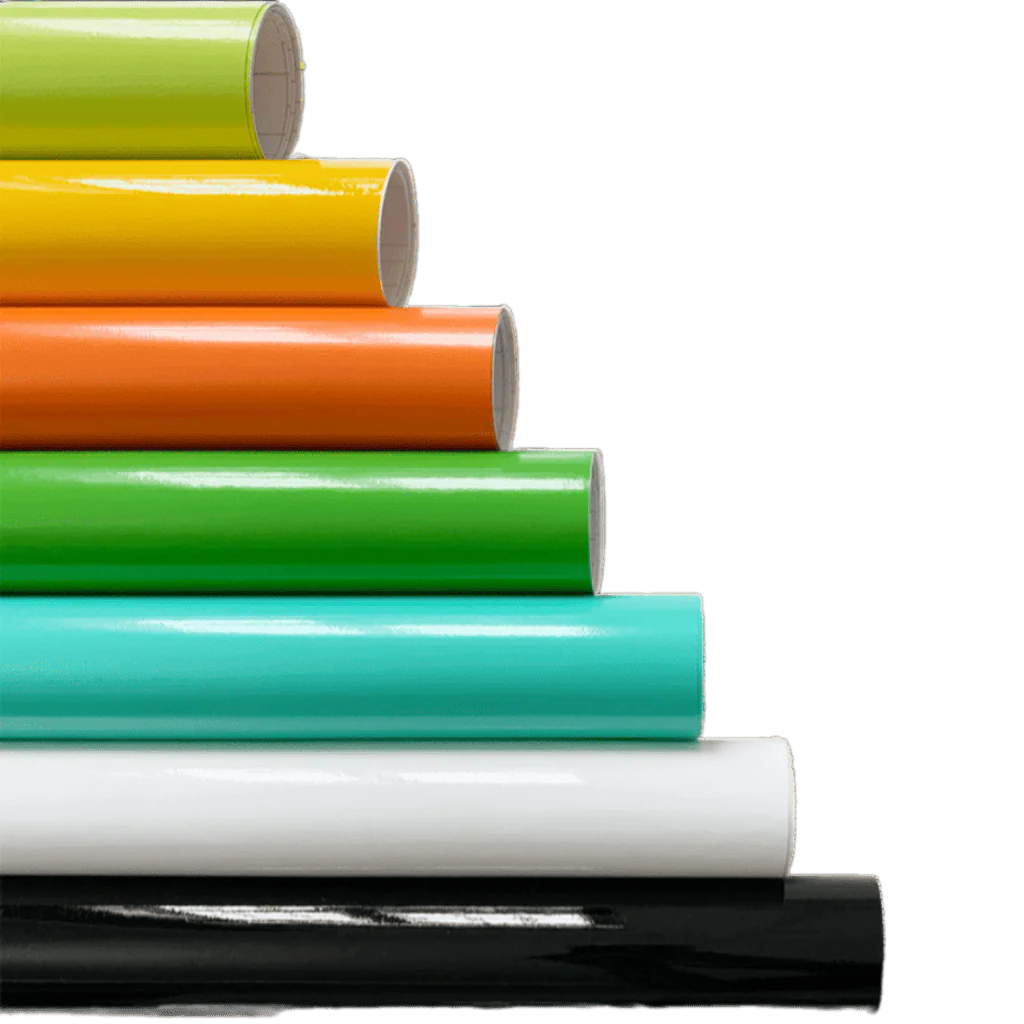 A vibrant stack of ChroMorpher Gloss Vinyl Rolls arranged in layers of lime, yellow, orange, green, teal, white, and black, showcasing their high-gloss finish and versatile application.