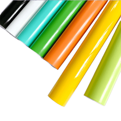 A lineup of ChroMorpher Vibrant Gloss Vinyl Rolls in bold colors such as black, white, teal, green, orange, yellow, and lime, highlighting their glossy surface and premium quality.