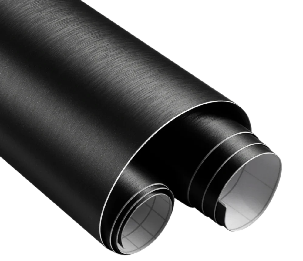 Close-up of ChroMorpher Brushed Satin Vinyl Roll showcasing its elegant black brushed texture, ideal for automotive and interior styling projects.