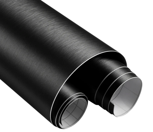 Close-up of ChroMorpher Brushed Satin Vinyl Roll showcasing its elegant black brushed texture, ideal for automotive and interior styling projects.