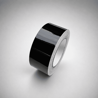 A roll of glossy black tape standing upright on a light gray gradient background.