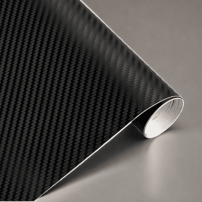 A roll of ChroMorpher carbon fiber vinyl in black, showcasing a realistic 3D carbon fiber texture, ideal for stylish and durable vehicle or surface customization.