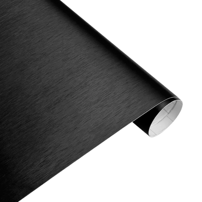A detailed view of ChroMorpher Brushed Black Vinyl roll, featuring a matte satin finish, ideal for elegant car wraps and interior enhancements.