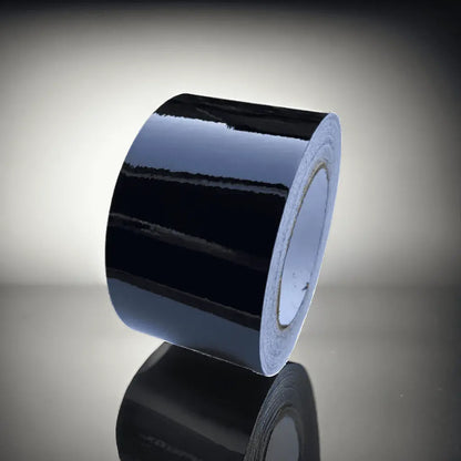 Roll of ChroMorpher Glossy Chrome Delete Tape with a high-gloss finish, ideal for achieving a seamless, modern look by covering chrome accents.
