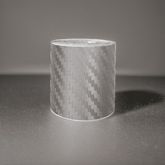 ChroMorpher Carbon Fiber Protective Tape roll displayed on a reflective surface.