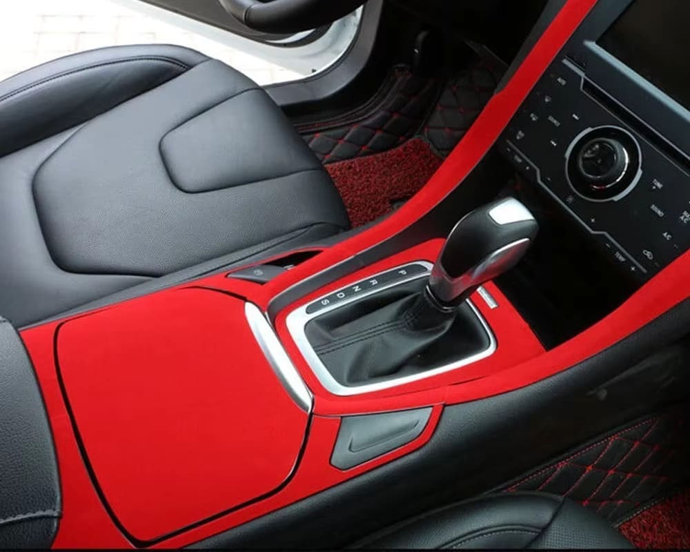 Car center console and interior details enhanced with ChroMorpher Suede Touch Vinyl in red, adding a refined, custom look with a soft texture