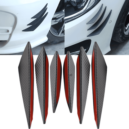 A 6-piece universal rear bumper spoiler diffuser kit with a carbon fiber-style finish and red adhesive backing. The image displays the diffusers installed on a white car’s rear bumper, creating a sleek, aggressive, and sporty appearance while improving aerodynamics.