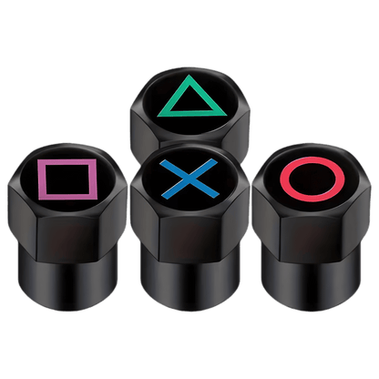 A set of four black aluminum tire valve caps featuring gaming-inspired button symbols: green triangle, red circle, blue X, and pink square. These durable and stylish valve caps are designed for cars, motorcycles, bicycles, and other vehicles, offering dustproof and leak-proof protection with a unique gamer aesthetic.