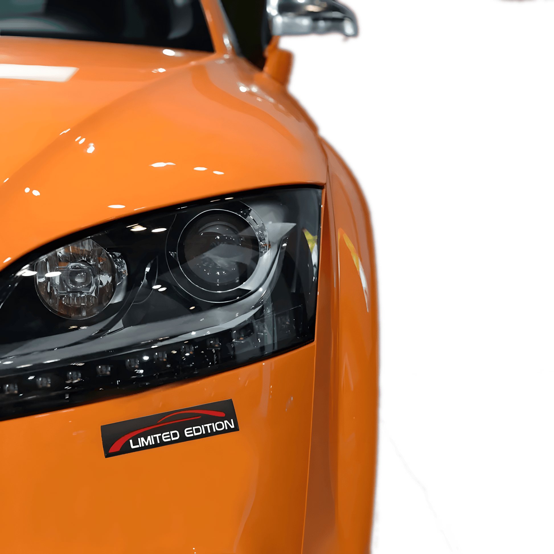 ChroMorpher Limited Edition 3D car emblem in black and red, placed on the front of an orange sports car, highlighting a "LIMITED EDITION" badge for a personalized, exclusive look.