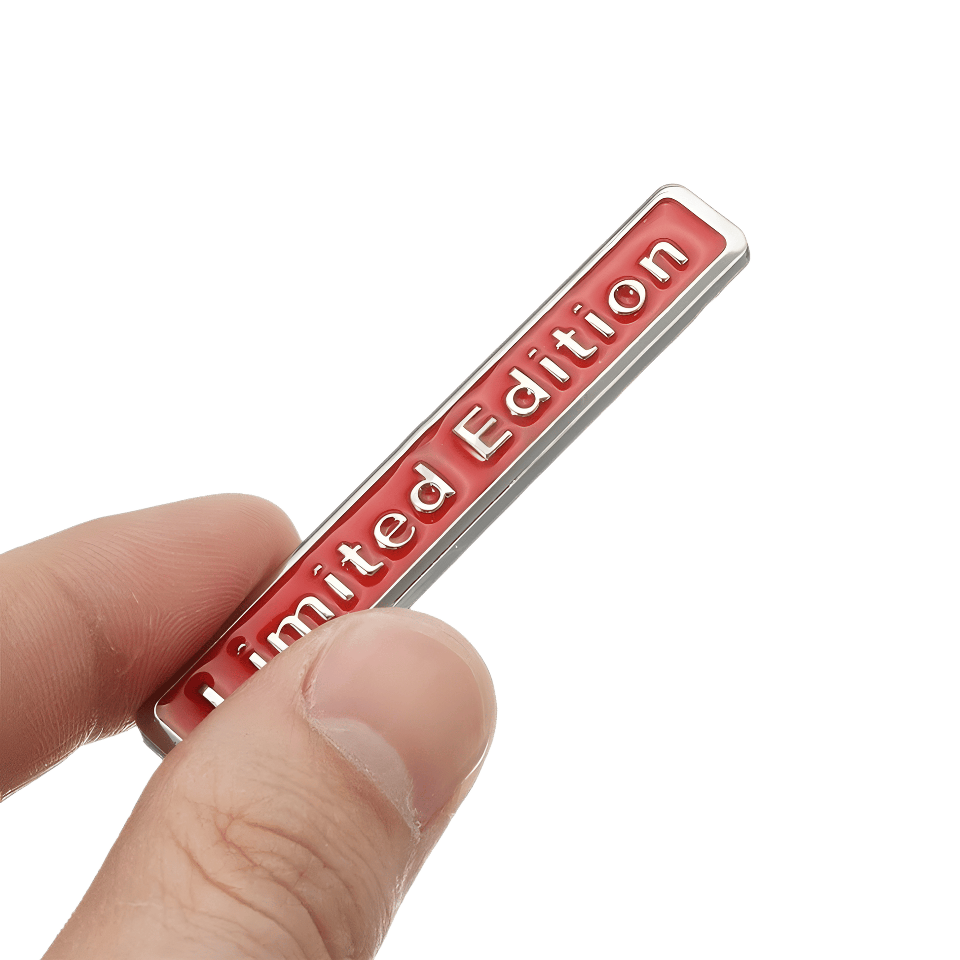 ChroMorpher Limited Edition 3D Metal Emblem held in hand, showcasing its sleek red design on a silver metal background.