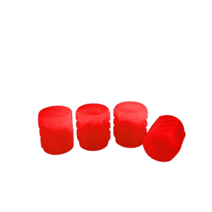 A set of four luminous tire valve caps in bright red, designed to glow in the dark for enhanced visibility and style.