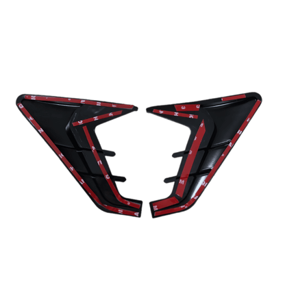A pair of ChroMorpher Side Fender Vents shown from the back, revealing the pre-applied 3M adhesive tape for easy, drill-free installation. The strong adhesive backing ensures a secure fit on any vehicle, providing a seamless and hassle-free upgrade. Designed with a sleek aerodynamic shape, these vents enhance the car’s exterior styling while maintaining durability and weather resistance. Available in Glossy Black and Carbon Look finishes.