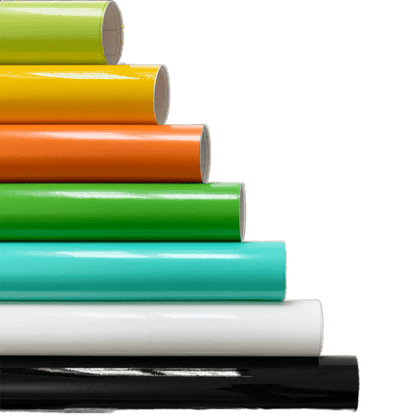 A vibrant stack of ChroMorpher Gloss Vinyl Rolls arranged in layers of lime, yellow, orange, green, teal, white, and black, showcasing their high-gloss finish and versatile application.