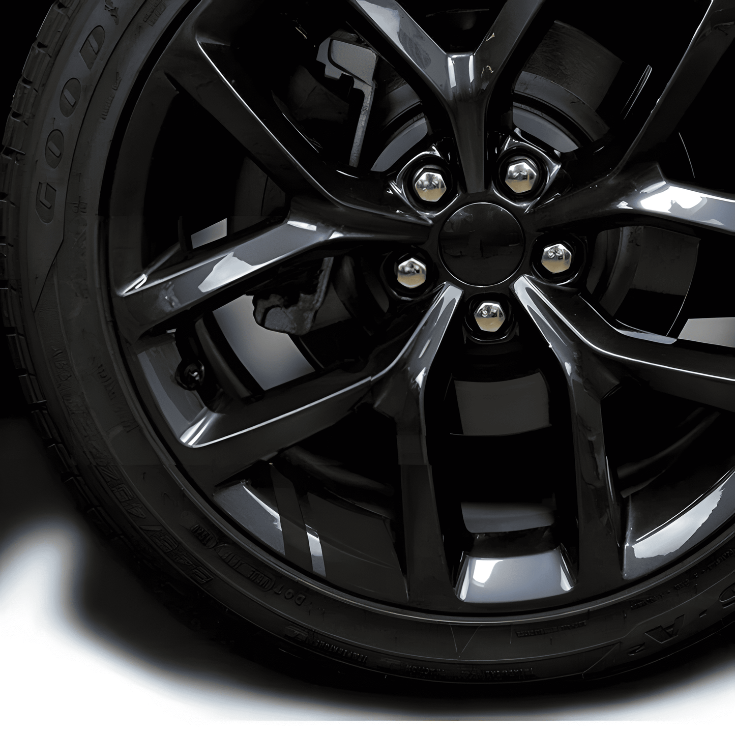 A sleek black reflective rim decal strip applied to a black alloy wheel, blending seamlessly for a stealthy, premium look. Designed to enhance nighttime visibility while maintaining a clean, subtle appearance, these waterproof stickers fit 18'' - 21'' rims for cars and motorcycles.