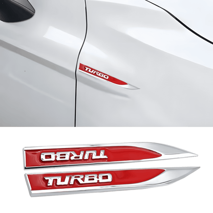 ChroMorpher Turbo Red and Chrome Fender Emblems displayed on a white car, showcasing sleek red turbo badges with a shiny chrome finish for a sporty, modern look.
