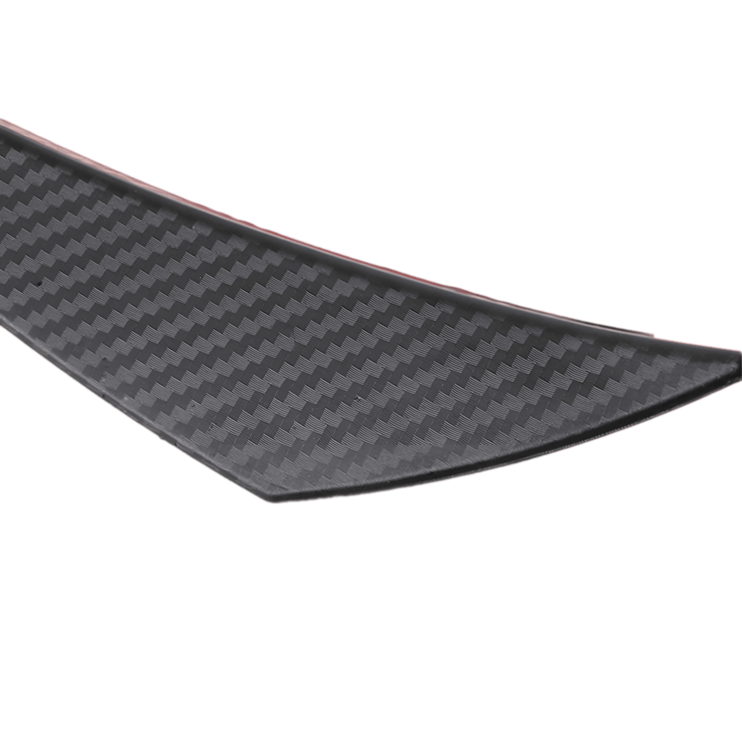 A detailed close-up view of a carbon fiber-style rear bumper diffuser fin, showcasing its sleek texture, aerodynamic design, and red adhesive backing for easy installation. The high-quality material enhances a vehicle's sporty appearance while improving aerodynamics.