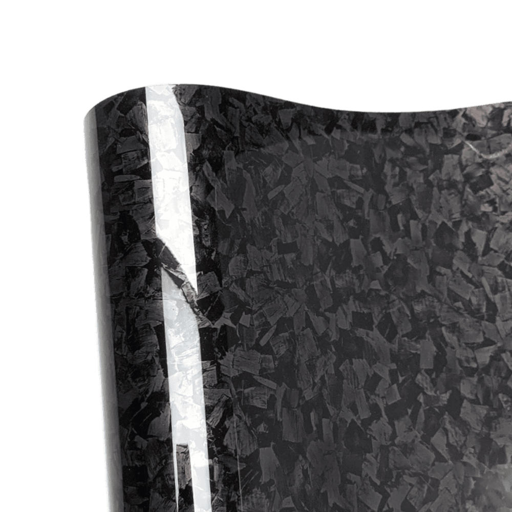 A detailed close-up of the Glossy Forged Carbon Fiber Vinyl Wrap showcasing its sleek black forged carbon pattern and high-gloss finish. The reflective surface highlights the premium quality, perfect for car and accessory customizations with a professional-grade look.
