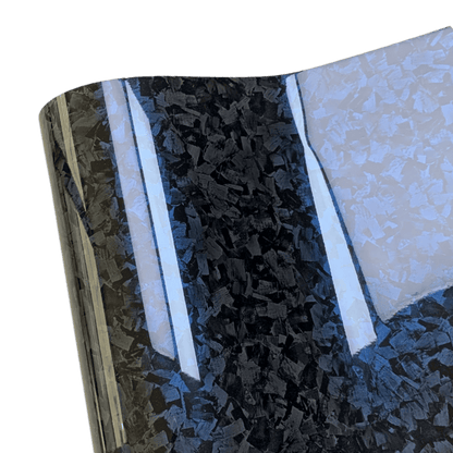 A close-up view of the Glossy Forged Carbon Fiber Vinyl Wrap featuring a reflective blue highlight. The intricate forged carbon pattern and high-gloss finish emphasize the premium quality, ideal for enhancing car exteriors, interiors, and accessories with a luxurious touch.