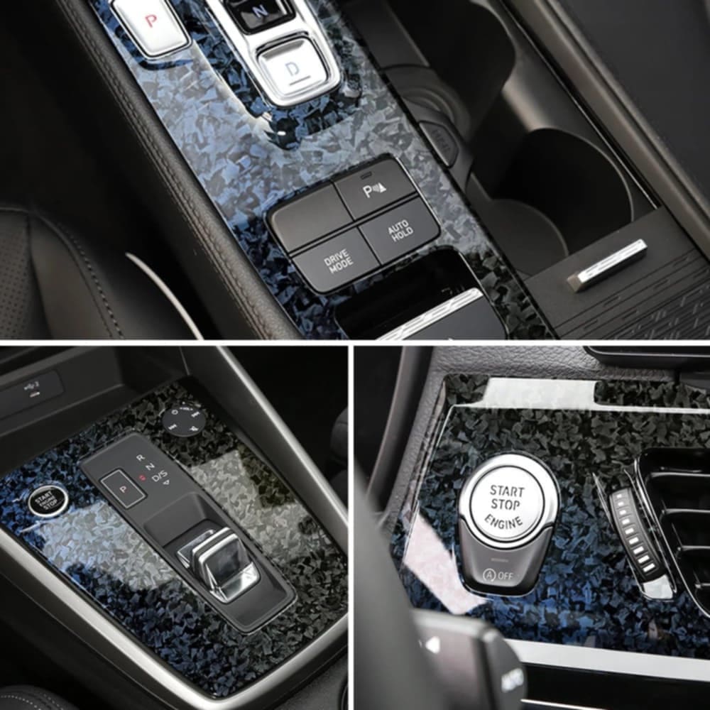 A car interior upgraded with Glossy Forged Carbon Fiber Vinyl Wrap in a blue forged carbon pattern. The wrap is applied to the center console, gear selector area, start-stop engine button surround, and additional trim pieces, showcasing a high-gloss finish and luxurious aesthetic.