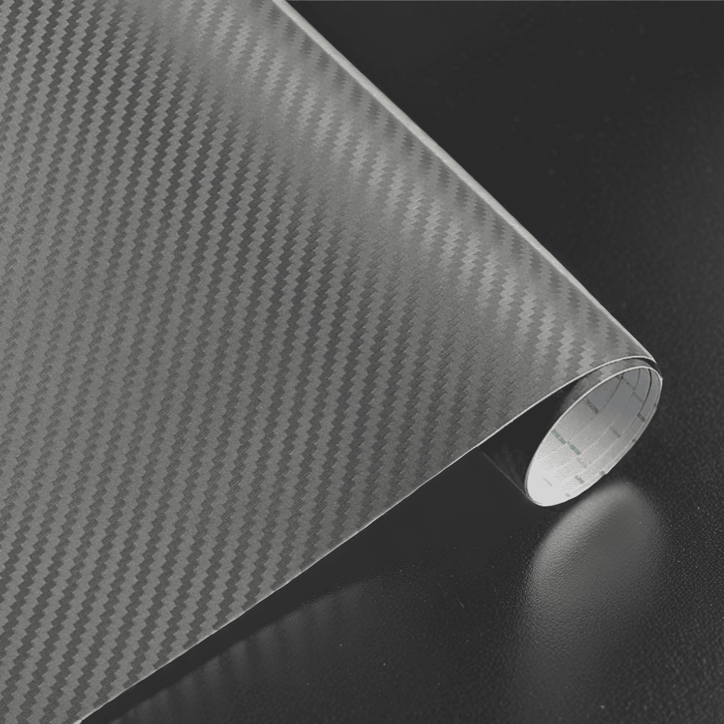 A roll of ChroMorpher carbon fiber vinyl in gray, featuring a sleek and realistic 3D carbon fiber texture, perfect for adding a refined and modern finish to vehicles or other customizable surfaces.