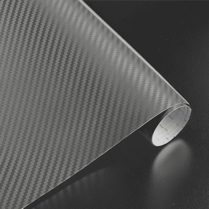 A roll of ChroMorpher carbon fiber vinyl in gray, featuring a sleek and realistic 3D carbon fiber texture, perfect for adding a refined and modern finish to vehicles or other customizable surfaces.