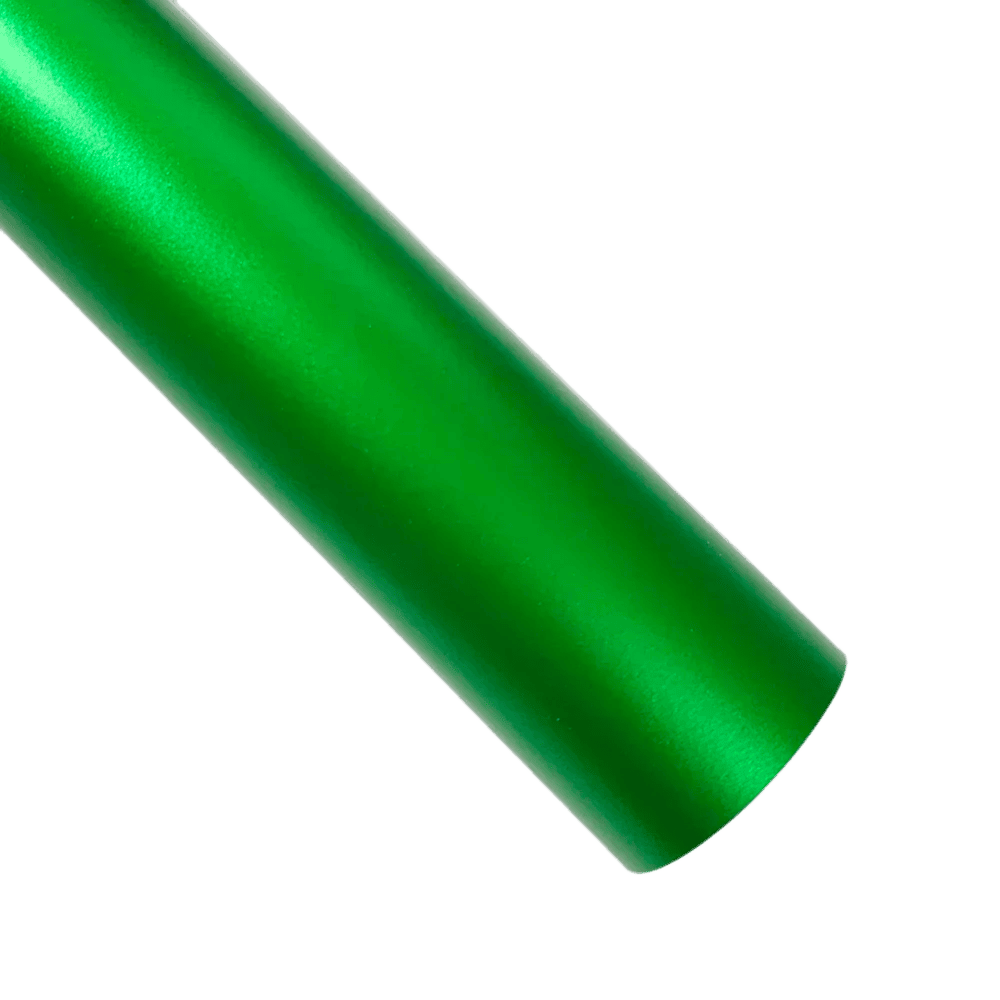 A vibrant green ChroMorpher Ice Matte Vinyl strip with a satin matte chrome finish, ideal for car wraps and DIY projects, displayed on a dark textured surface with soft lighting.