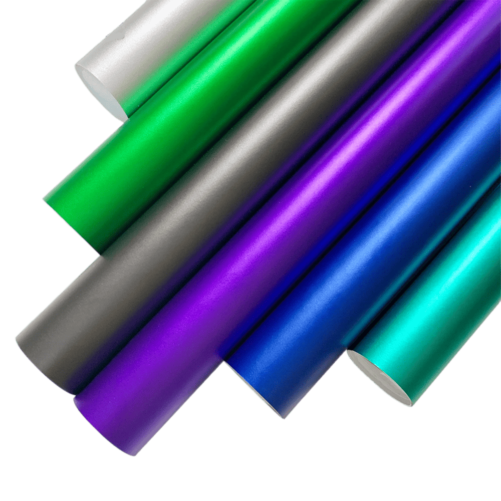 A vibrant collection of ChroMorpher Ice Matte Vinyl rolls in shades of green, gray, purple, blue, and teal, displayed with a satin matte chrome finish, ideal for vehicle wraps and DIY customization projects.