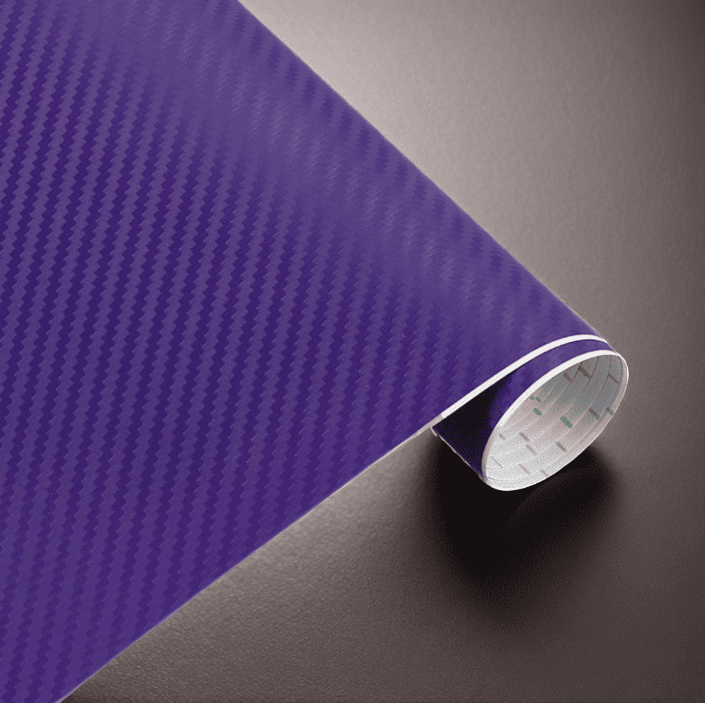 A roll of ChroMorpher carbon fiber vinyl in purple, showcasing a vibrant and realistic 3D carbon fiber texture, perfect for creating a bold and unique finish on vehicles or various surfaces.