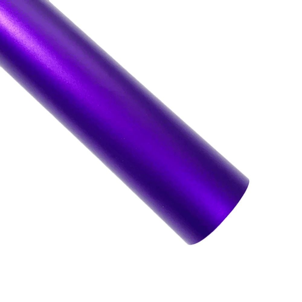 A bold purple ChroMorpher Ice Matte Vinyl strip with a satin matte chrome finish, perfect for car customization and creative projects, displayed on a dark textured surface.