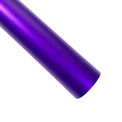 A bold purple ChroMorpher Ice Matte Vinyl strip with a satin matte chrome finish, perfect for car customization and creative projects, displayed on a dark textured surface.