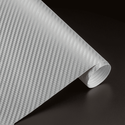 A roll of ChroMorpher carbon fiber vinyl in silver, featuring a high-quality 3D carbon fiber texture, perfect for achieving a sleek and polished look on vehicles and various surfaces.