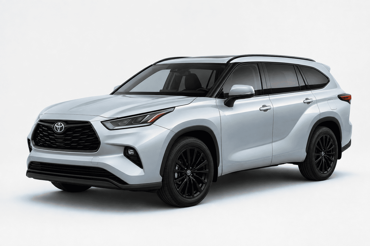 A silver Toyota Highlander SUV with black wheels, shown from a three-quarter front angle on a light gray studio background.
