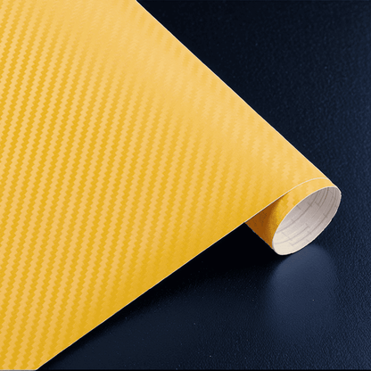 A roll of ChroMorpher carbon fiber vinyl in yellow, featuring a vivid and realistic 3D carbon fiber texture, perfect for creating a vibrant and eye-catching finish on vehicles or other surfaces.