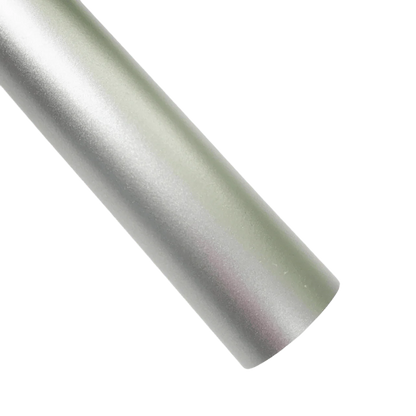 A sleek pearl white ChroMorpher Ice Matte Vinyl roll with a satin matte chrome finish, ideal for vehicle wraps and creative projects, displayed against a soft gray background.