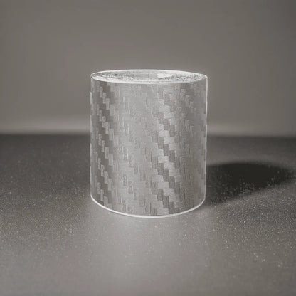 ChroMorpher Carbon Fiber Protective Tape roll displayed on a reflective surface.