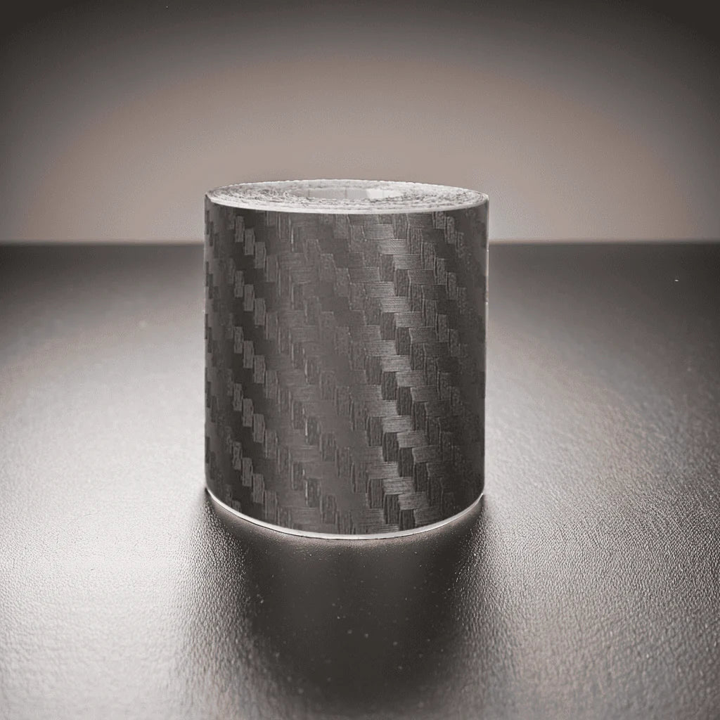 ChroMorpher Carbon Fiber Protective Tape roll displayed on a reflective surface.