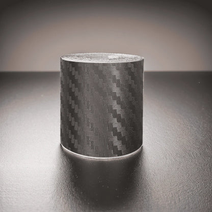 ChroMorpher Carbon Fiber Protective Tape roll displayed on a reflective surface.