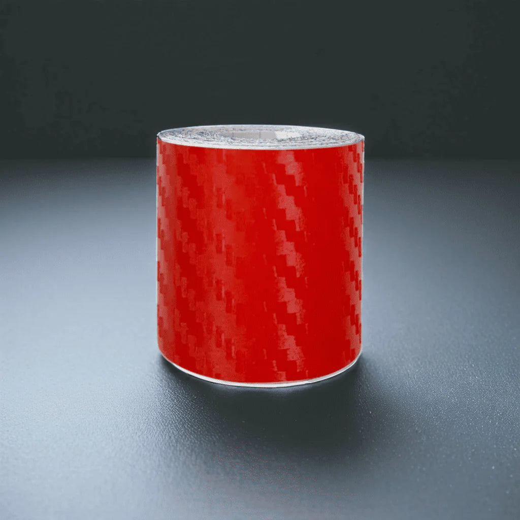 ChroMorpher Carbon Fiber Protective Tape roll displayed on a reflective surface.