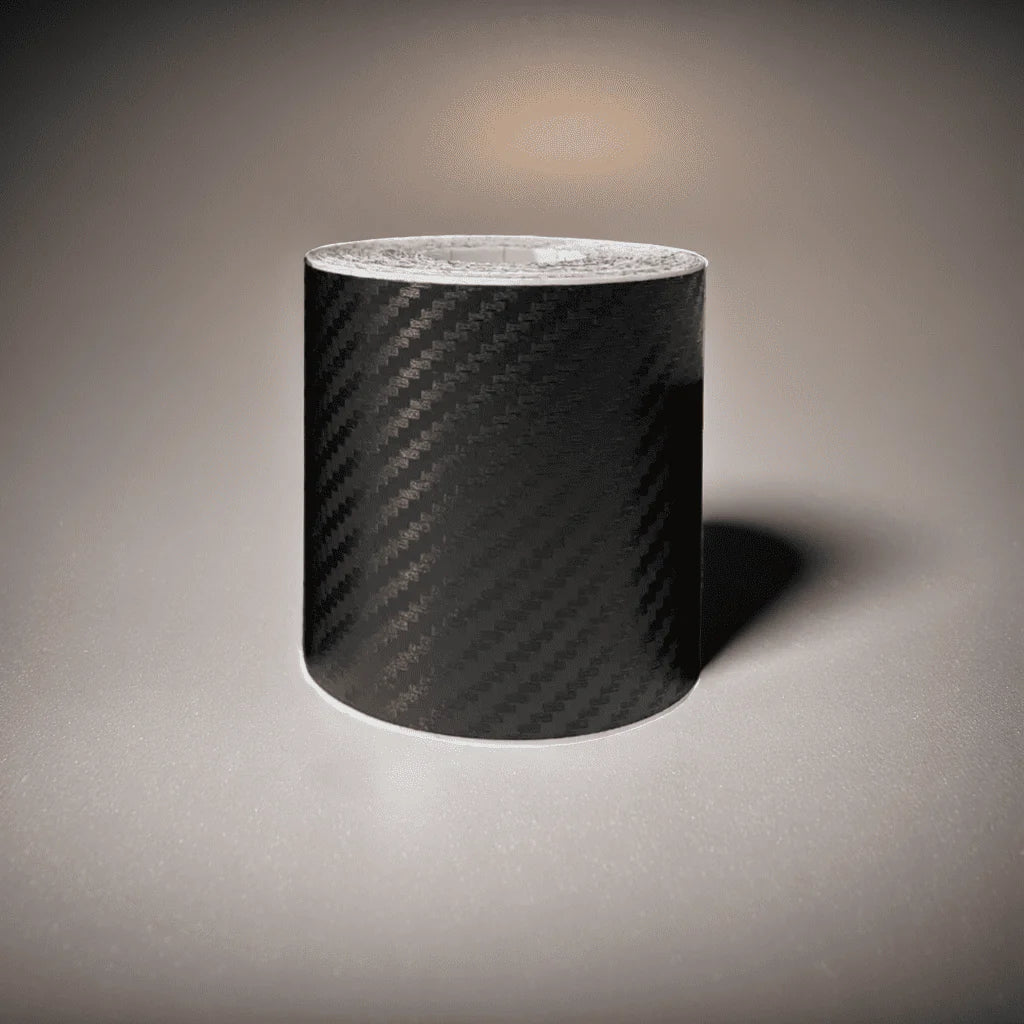 ChroMorpher Carbon Fiber Protective Tape roll displayed on a reflective surface.