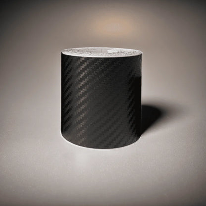 ChroMorpher Carbon Fiber Protective Tape roll displayed on a reflective surface.