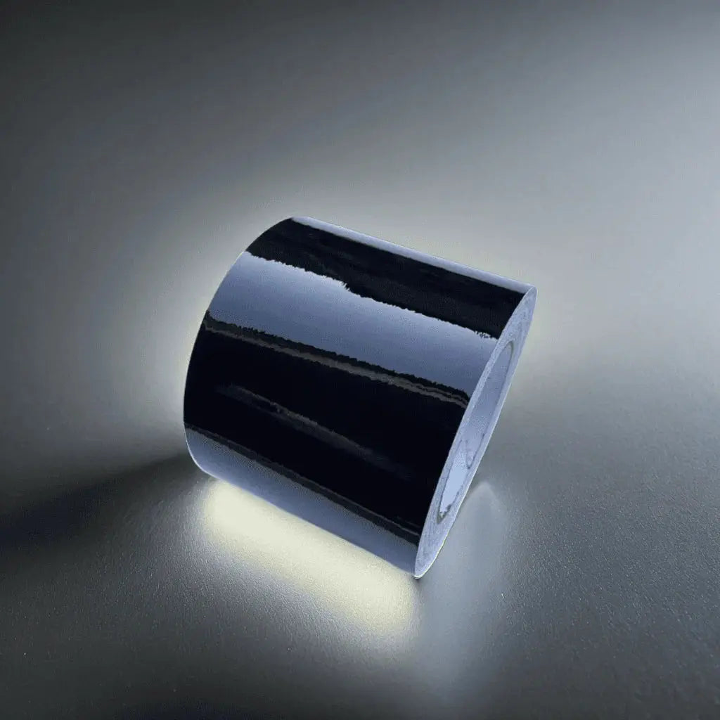 Close-up of ChroMorpher Glossy Chrome Delete Tape, showcasing its reflective high-gloss finish perfect for chrome accent customization.