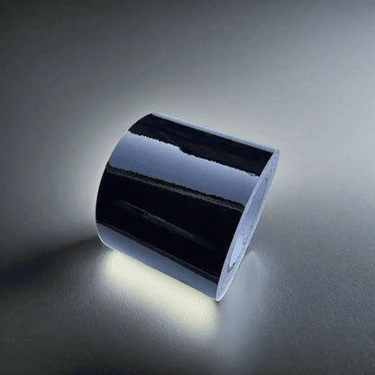 Close-up of ChroMorpher Glossy Chrome Delete Tape, showcasing its reflective high-gloss finish perfect for chrome accent customization.